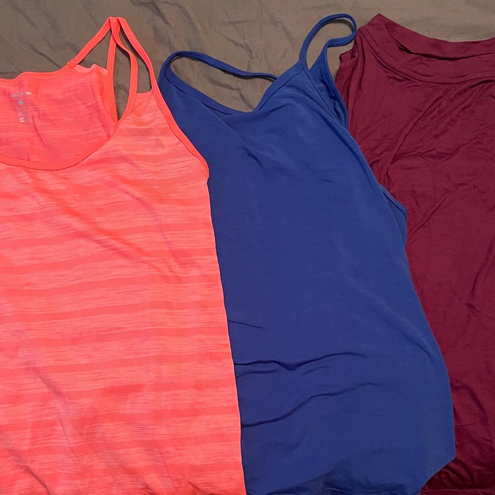 Three sleeveless workout tops, size L, EUC
